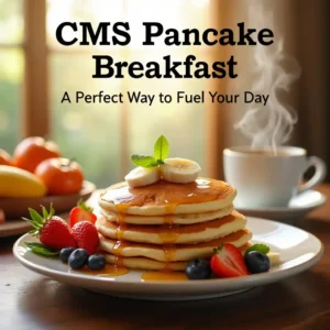 A warm, inviting plate of pancakes served with syrup, butter, and a side of fresh fruit at the CMS Pancake Breakfast event.